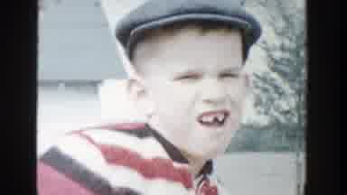Michigan (1958): Young Boy Wearing Beret Missing Tooth Goes Down Slide In Front Of