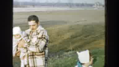 Michigan (1958): Family With Two Parents And Four Kids Wearing Coats Walking