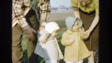 Michigan (1958): Two Toddlers Walking With Three Adults In A Field Wearing Coats