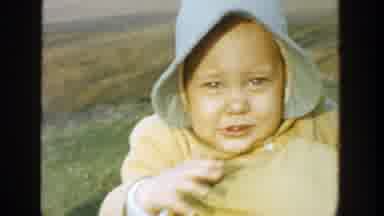 Michigan (1958): Babies In Bonnets Being Held By Their Mothers In A Field