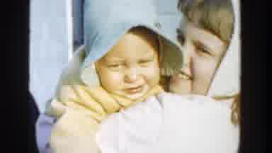 Michigan (1958): Girl Holding And Kissing Baby With Older Girl And Boy Outside