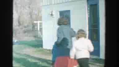 Michigan (1958): Students And Their Teacher Play In The Schoolyard On A Cold Day