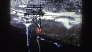 New York (1962): Red Bucket On Skyride Cable Moving Down A Mountain View Of Snow
