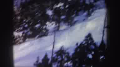 New York (1962): Aerial View Of A Person Skiing Down A Snowy Bank With Snow Trees