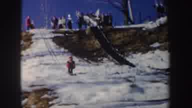 New York (1962): Young Professional Skier Jumps High And Lands On A Downhill