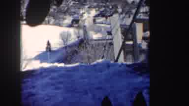 New York (1962): Person Wearing Red Sweater Descends Down Ski Jump Ramp On A Sunny