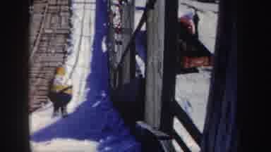 New York (1962): Ski Jumping Down A Wood Ramp In The Winter On Snow Yellow Coat