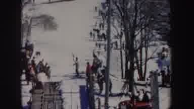 New York (1962): Man Wearing Black Pants Falls While Skiing On A Sunny Day