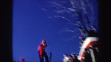 New York (1962): Person Wearing Red Sweater Jumps On Skis On A Bright Sunny Day