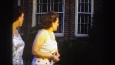 Massachusetts (1949): Two Women In Dresses Looking Then Three Men In Suits On