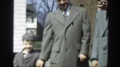 Massachusetts (1949): Little Kids In Coats Wave Beside Their Parents