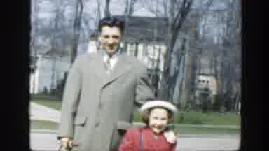 Massachusetts (1949): A Man In A Khaki Trench Coat Standing Next To A Child With A