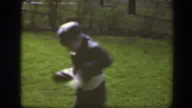 Massachusetts (1949): A Boy Whirls Around On The Green Grass Having Fun