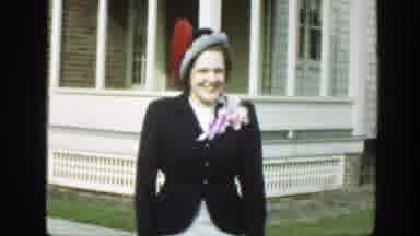 Massachusetts (1949): Woman Wearing Black Jacket Walks Towards Camera Smiling On A
