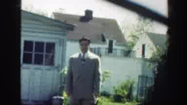 Massachusetts (1949): Man And Boy Waved To Camera Outside A White Home
