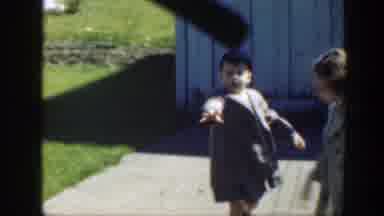 Massachusetts (1949): A Small Boy Showing The Camera A Small Ball Wearing Great