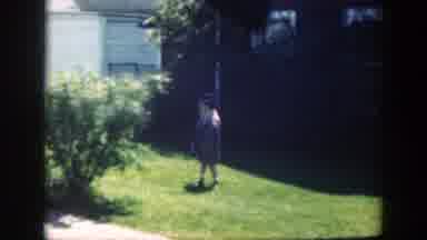 Massachusetts (1949): Girl Wearing Yellow Coat Plays With Small Black Object On A