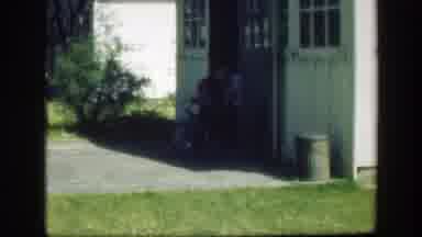 Massachusetts (1949): Grandpa Guiding A Child On A Bike While Another Watches Them