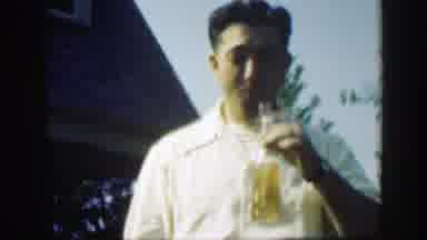 Massachusetts (1949): Man Drinks A Beer At A Good Sized Social Gathering