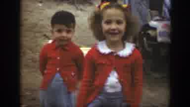 Massachusetts (1949): Two Young Children Dressed In Red Clothing Walk Towards The