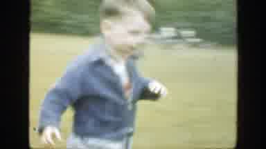 Massachusetts (1949): A Smiling Kid Runs To His Mummy As He Is Playing On The