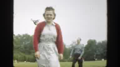 Massachusetts (1949): Middle Aged Woman Wearing White Dress Walking To Pick Up