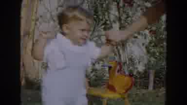 Glendale California (1962): Woman Wearing Pink Dress Holds Hand Of Toddler Wearing