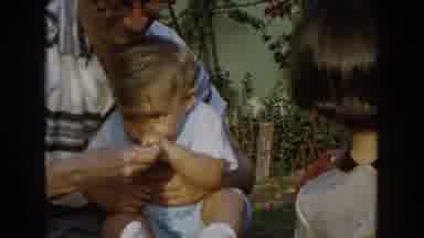 Glendale California (1962): Small Child Gets Fed By His Father While His Little