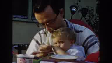 Glendale California (1962): Adult Male Feeding A Fair Haired Toddler From A Bowl