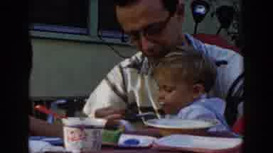 Glendale California (1962): A Father Holds His Son While The Mother Spoon feed Him