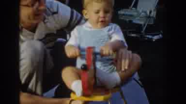 Glendale California (1962): Young Boy Being Rocked By An Adult Man On A Rocking