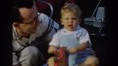 Glendale California (1962): Toddler Wearing Blue Romper Rides On Red Rocking Dog