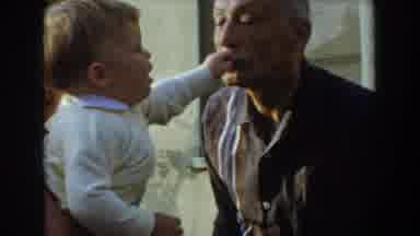 Glendale California (1962): An Old Man Jokingly Spanks A Little Baby After Taking
