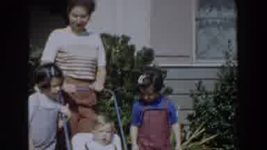 Glendale California (1962): Woman Wearing Brown And White Sweater Pushes Baby In