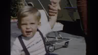 Glendale California (1962): Person Wearing Red Pants Holds Hand Of Toddler Wearing