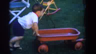 Glendale California (1962): Sister And Brother Playing With Their Family In The