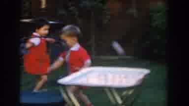 Glendale California (1962): Child Wearing Red Running In A Yard Playing With Toys