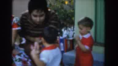 Glendale California (1962): Two Kids Dragging A Toy From The Hands Of Their Mother
