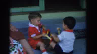 Glendale California (1962): Two Boys Dragging A Toy While The Third One Looks On