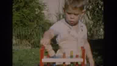 Glendale California (1962): Little Boy Plays With Toy Hammer And Toy Work Bench