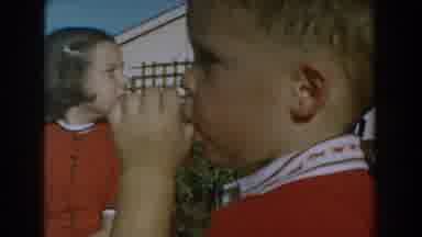Glendale California (1962): Two Children Sit In The Sun And The Little One Sucks