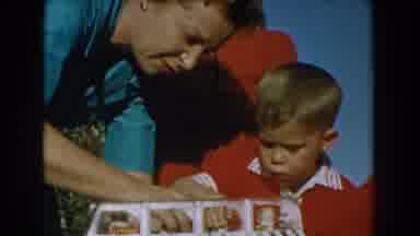 Glendale California (1962): Mother Helps His Son Assemble A Toy Car