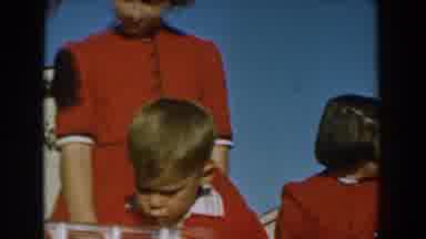 Glendale California (1962): A Woman In A Sexy Gown Talks To Children During An