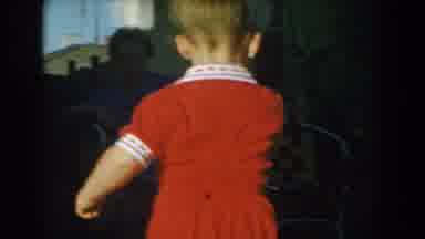Glendale California (1962): A Boy Plays With His Toy Whilst His Mother Watches On
