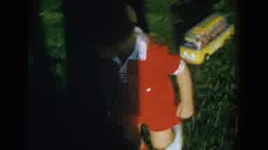Glendale California (1962): Toe-Headed Toddler Pulls A Toy Chicle