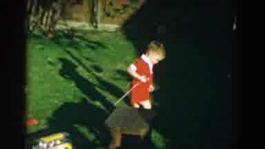 Glendale California (1962): Child Playing With A Trolley In The Garden Of Your