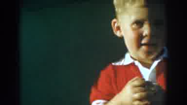 Glendale California (1962): Toddler Wearing Red Jumper Plays With Red Toy Truck On