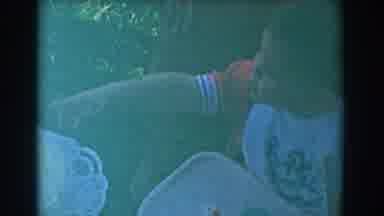 Glendale California (1962): A Child Playing On A Sunny Day On A Highchair Waiting