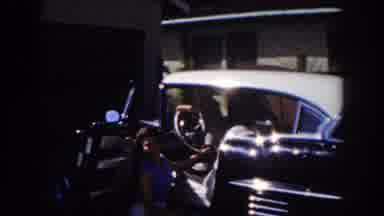 Glendale California (1962): Woman In White Shirt Stands Next To Car With Child