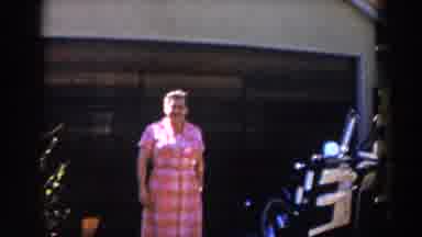 Glendale California (1962): An Elderly Woman Walks Out Of A House And Give A
